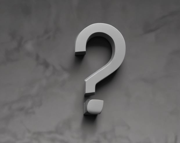 a blue question mark on a pink background