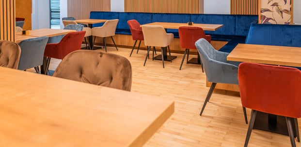 a restaurant with a wooden table and chairs