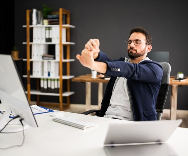 corporate wellbeing program physiotherapy exercise at desk for busy professionals