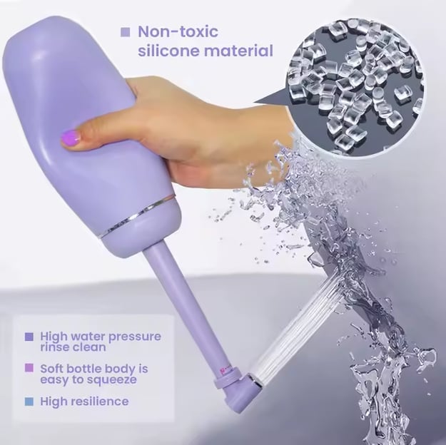 a hand holding and squeezing a portable water with water coming out of the nozzle