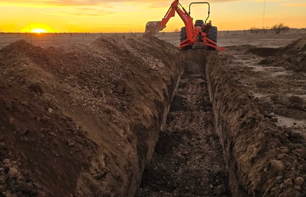 100-foot-leach-field-ditch-waiting-for-gravel-less-pipe-or infiltrator-leaching-chambers-intallation