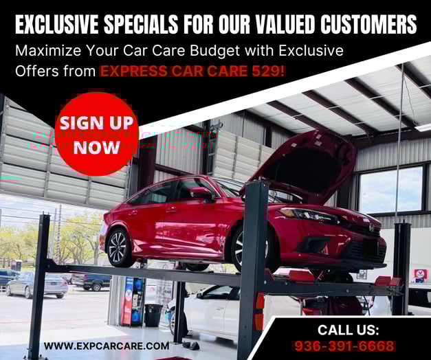 a red car being lifted by a lifter