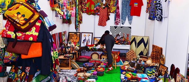 uthentic African products including vibrant clothes, traditional heritage items, handcrafted jewelry, aromatic food spices, a