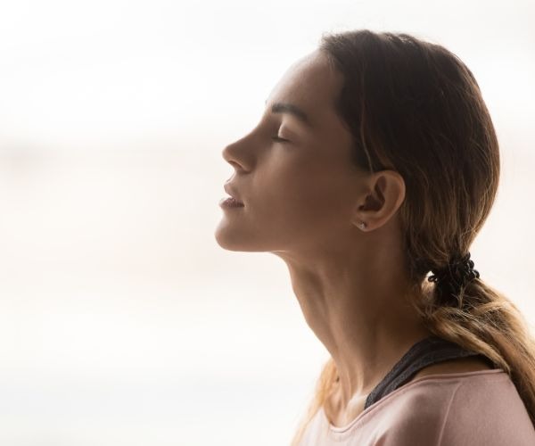 a woman with her eyes closed