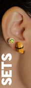 a woman wearing a sushi earring