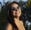 a woman with sunglasses and sunglasses on a sunny day
