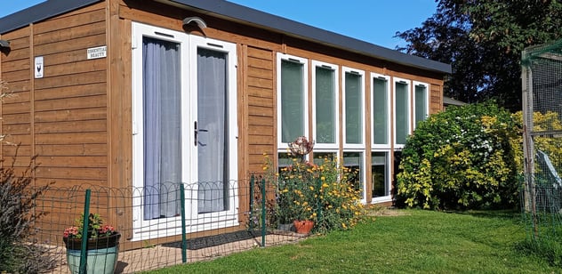 view of the outside of the salon, with beautiful blue sky