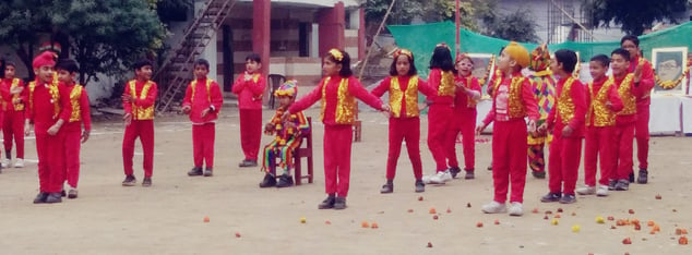 a group of young girls in red and yellow uniforms