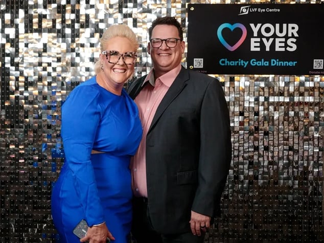 Guests at the Layton Vision Foundation Gala in front of the silver shimmer wall Brisbane.