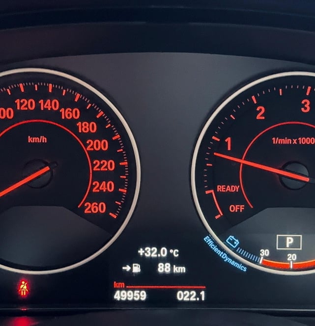 a dashboard with a clock and a clock on it