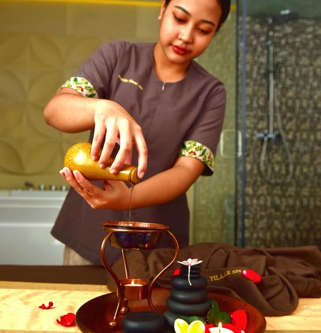 martha tilaar therapist pouring massage oils