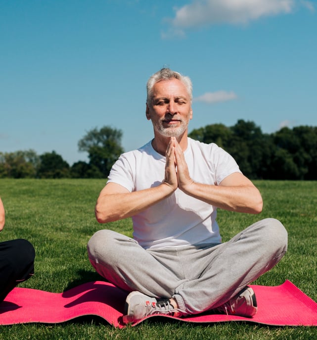 an image of a senior citizen doing yoga 