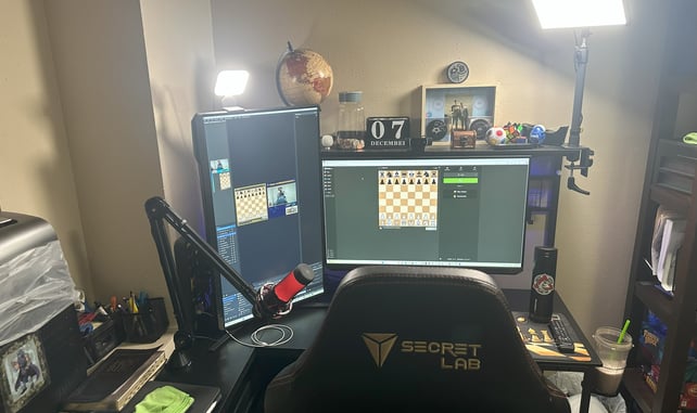 a desk with a computer monitor and a keyboard