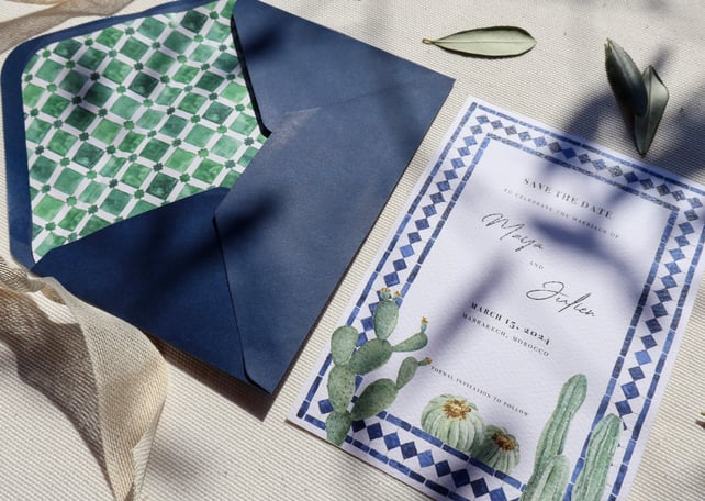 layout of dark blue envelope with custom liner and coordinated wedding invitation