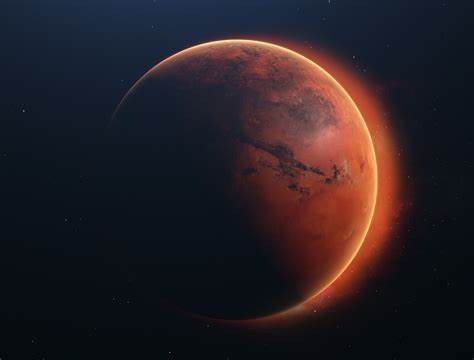 Mars with sun rays coming from behind it.