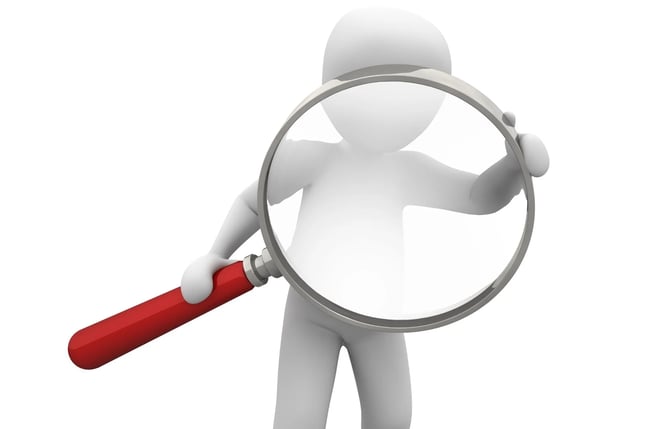a person holding a magnifying magnifying magnifying magnifying