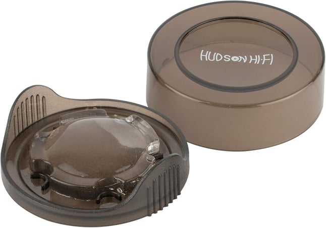 a close up of a brown plastic container with a hole in the lid