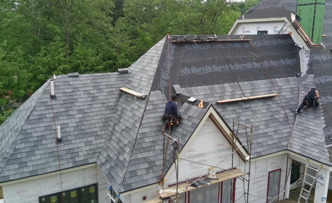 classic slate roof being installed on a new construction