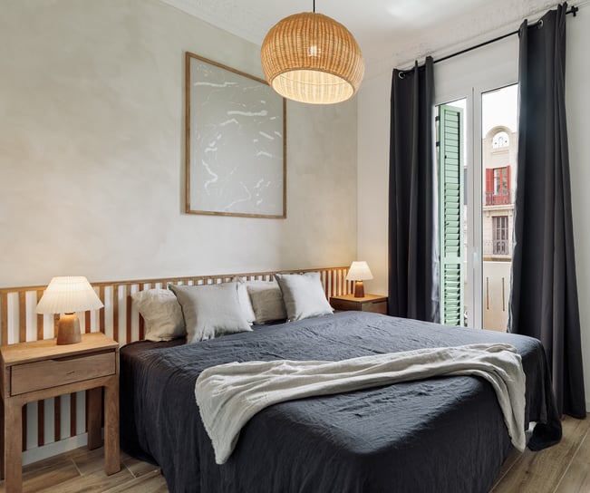 Elegant bedroom with natural textures, custom headboard, and calming color palette interior design