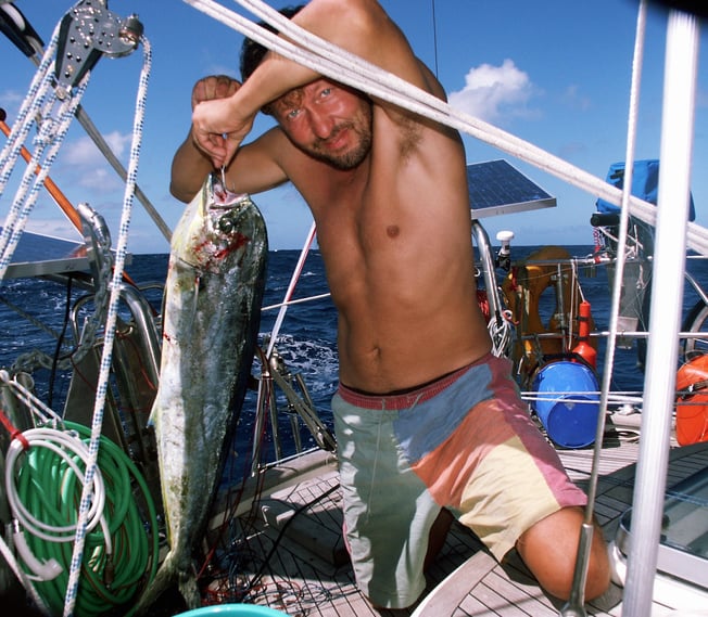 Yanne with Dorado fish caught from his yacht