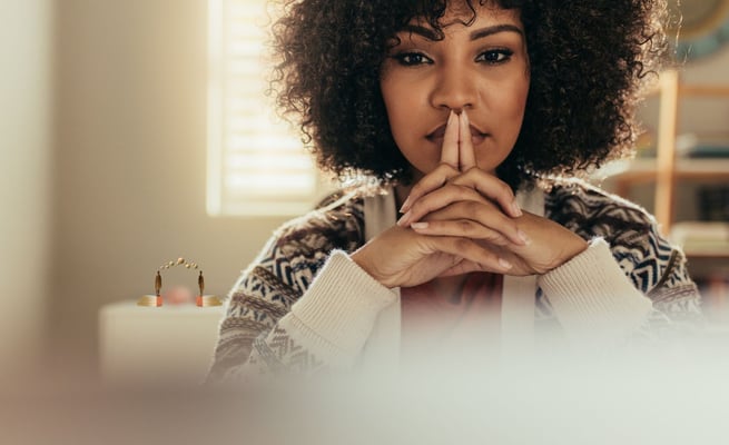 Black woman with hands together