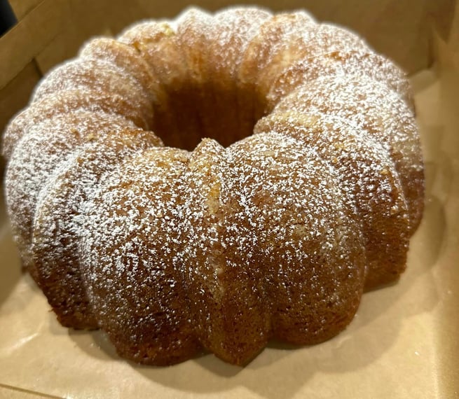 a cake with a bunt of powdered sugar on top of it