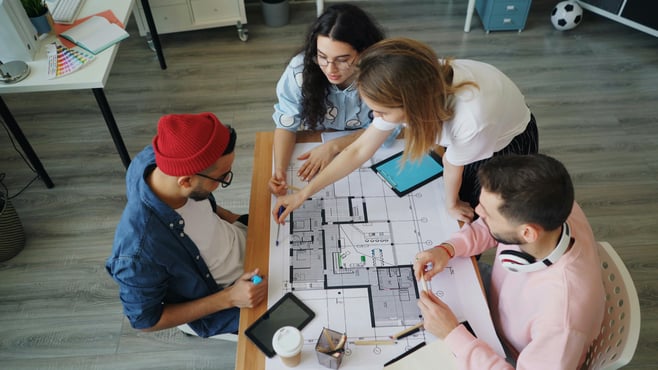 a group of people sitting around a table