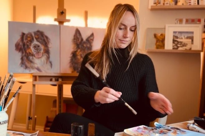Working on a commission in my art studio