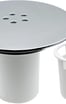 a white toilet with a white sink and a white trash canister