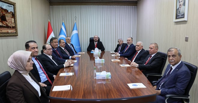 a group of people sitting around a table