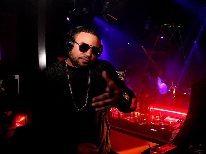 a dj Rico Sanchez in a dj booth at a nightclub
