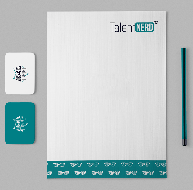 a branded letterhead with business cards and pencil