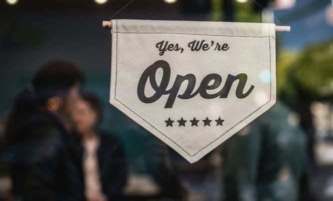 a sign that says yes we're open