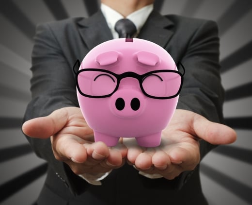 two hands showing money box