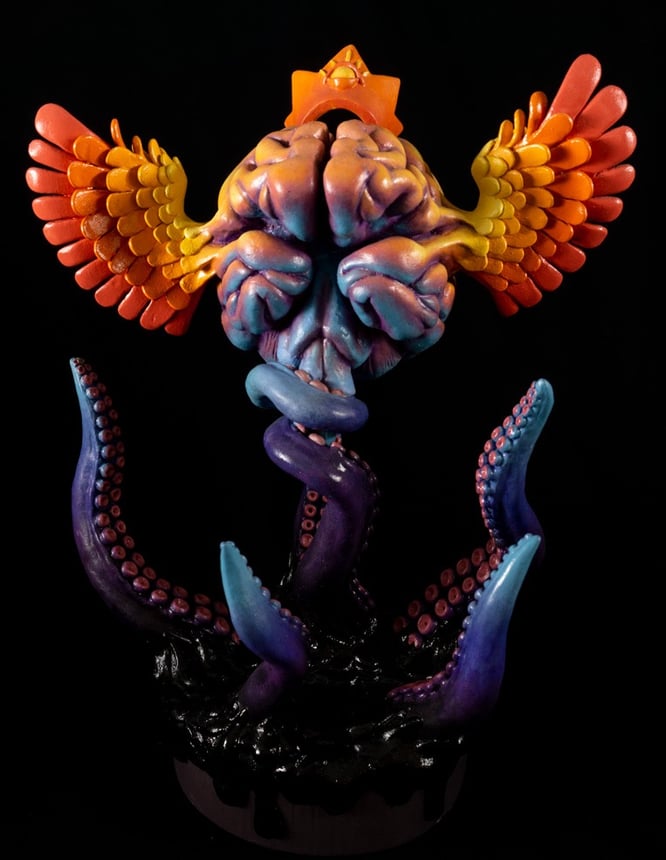 sculpture of a brain with wings trying to fly with wings, but it's being held down by tentacles