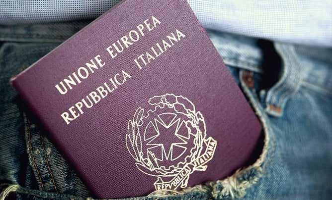 a passport is shown in the pocket of a man's jeans