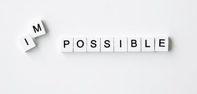 a white boarder with the words impossible possible