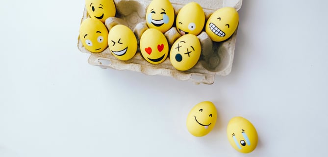 a carton of eggs with smiley faces on them