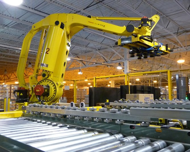a space where there are industrial machines, with belts, couplings, bearings, industrial hoses