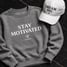 gray crewneck and hoodie and cap with motivational sentence