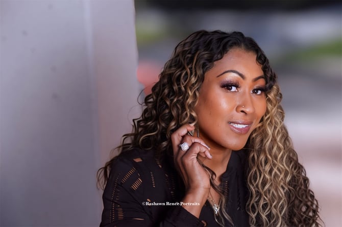a woman with curly hair and a black shirt Business head shots