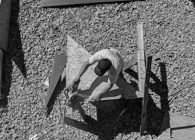 carpenter working with saw