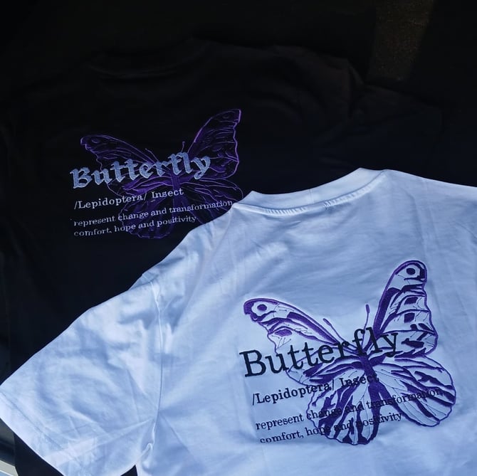 a variety of t - shirts with butterfly wings