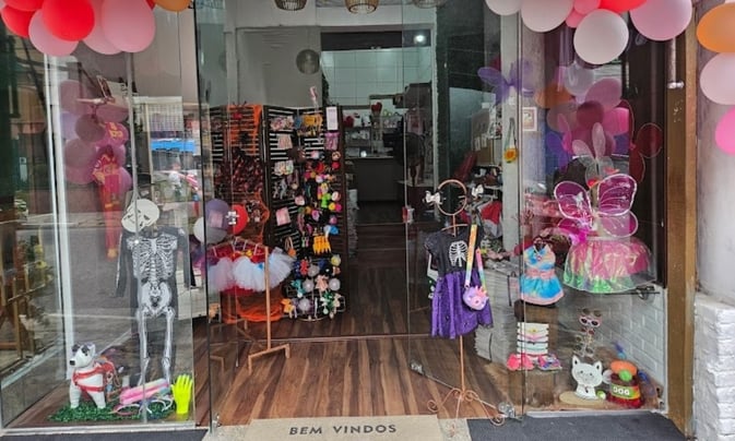 a storefront door with balloons and balloons