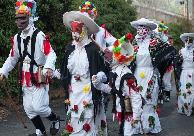 a group of people dressed in costumes and hats