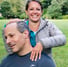 a man and woman smiling and posing for a picture