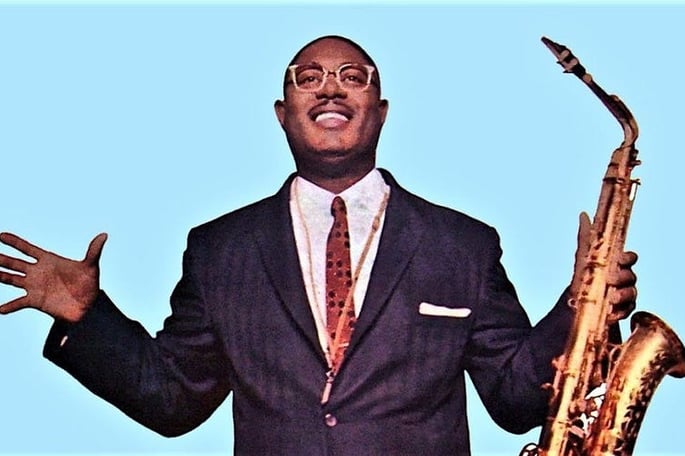 Photograph of musician Earl Bostic holding a saxaphone