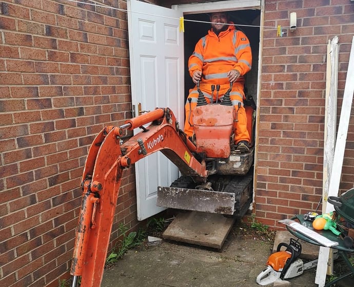 Digger operator preparing foundation in West Bromwich