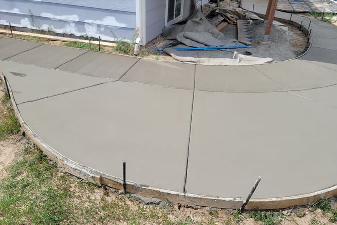 concrete contractor working on a concrete patio in lakewood, CO