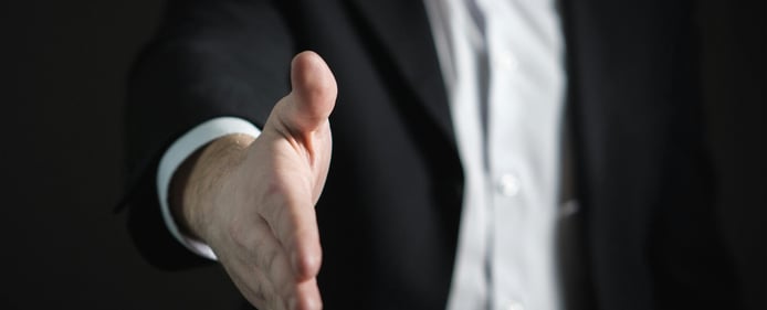 business owner inviting hand shake